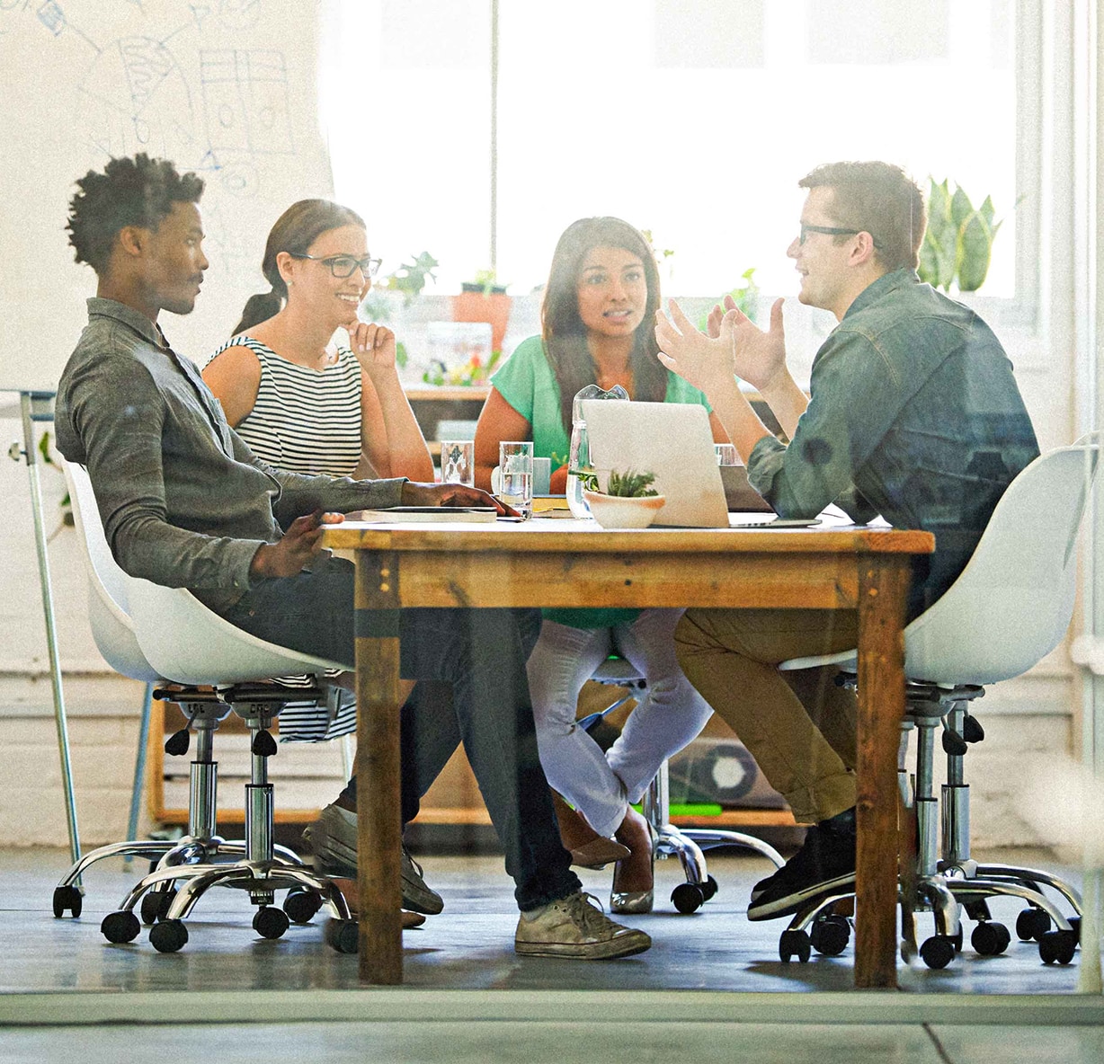 Group of adults talking around a table