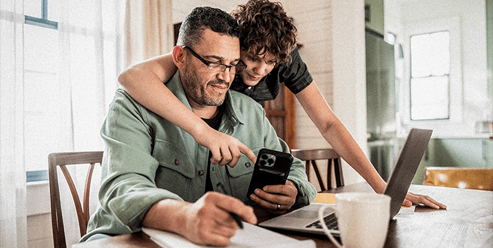 Parent and student using Arbiter Sports app on their phone.