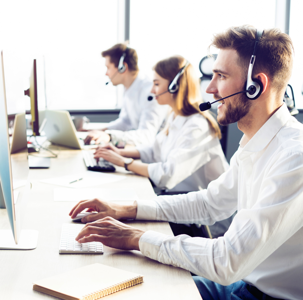 Arbiter Sports employee working at a computer.