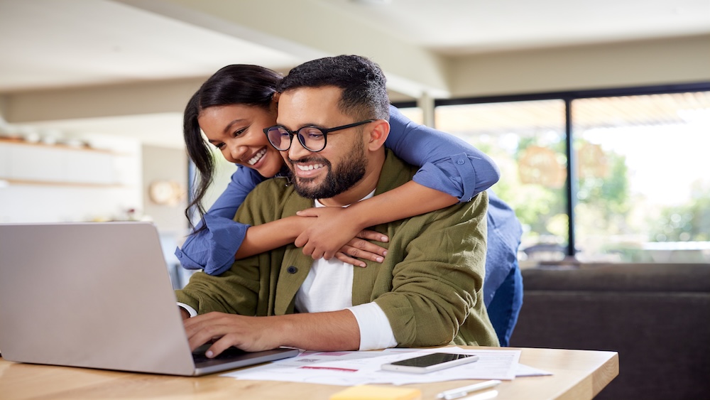 happy couple reading online school registration