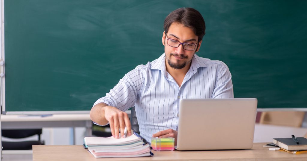 Male teacher planning a field trip