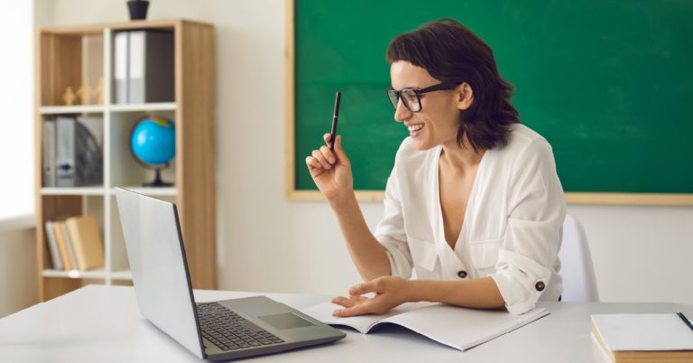 Teacher using student registration software